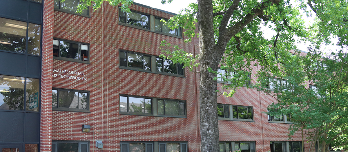 Matheson building with trees in front.