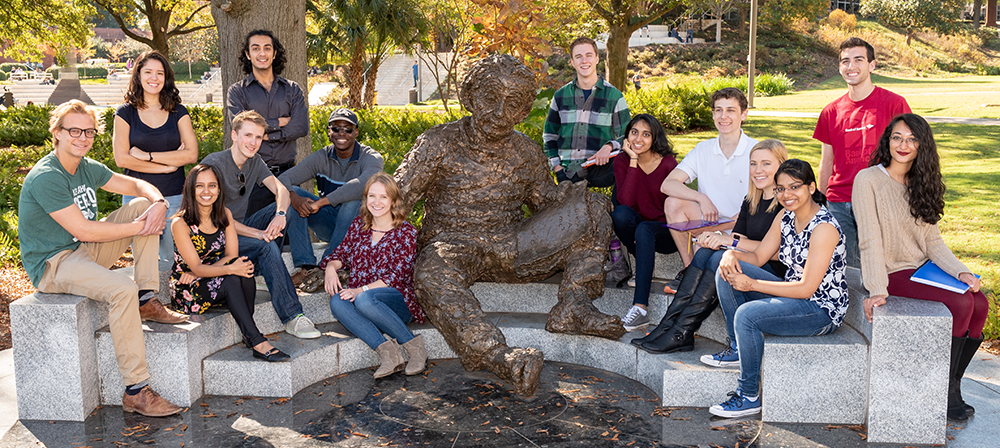 GT students sitting around the Einstein sculpture.