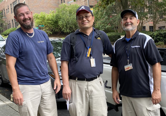 Three male HRL employees.